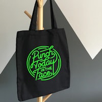 punch today the face tote bag