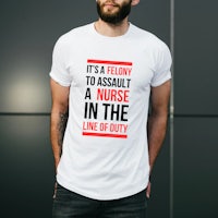 a man wearing a t - shirt that says it's a shame to assault a nurse in the life of duty