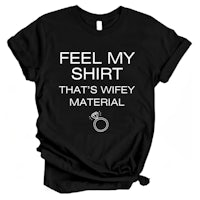 a black t - shirt that says feel my shirt that's wifey material