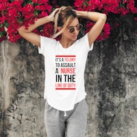 a woman wearing a white t - shirt with the words, i'm a nurse in the life of a nurse