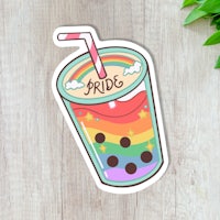 a sticker with a rainbow drink and a straw