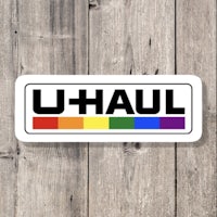 u-haul sticker on a wooden background