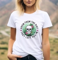a woman wearing a white t - shirt that reads grow from the dirt left you