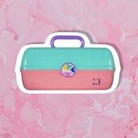 a pink, blue, and green suitcase on a pink background