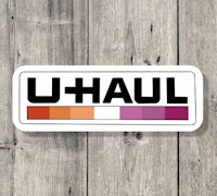 u haul logo on a wooden background