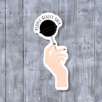 a sticker with a hand holding a spoon with the words'footballs' on it