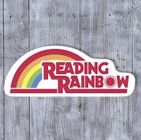 a sticker with the words reading rainbow on it