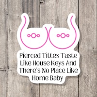 pierced tits taste like house keys and there's no place like home baby sticker