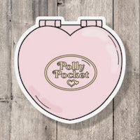 a pink heart shaped sticker with the word polly pocket on it