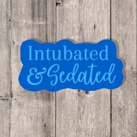 a blue sticker with the words intubated and sedated