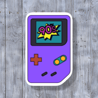 a purple gameboy sticker on a wooden surface