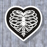 a black and white heart shaped sticker with a skeleton in it