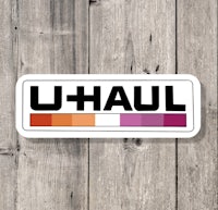 u haul logo on a wooden background