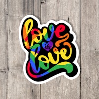 a sticker with the words love is love on it