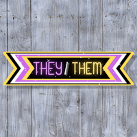 a neon sign that says they them on a wooden background