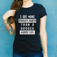 a black t - shirt that says i'm more of a private parts hooker