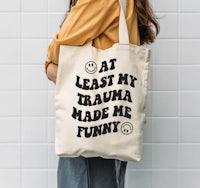 at least my trauma made me funny tote bag