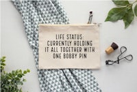 life status currently holding it together with one bobby pin pouch