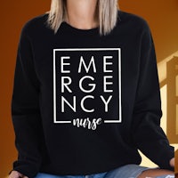 a woman wearing a black sweatshirt that says emergency nurse