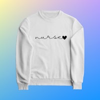 a white sweatshirt with the word nurse on it