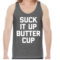 a man wearing a tank top that says suck it up butter cup
