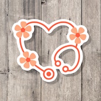 a heart shaped sticker with flowers and a stethoscope