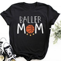 a black t - shirt that says baller mom