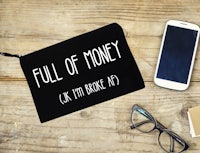 a black zipper pouch with the words full of money on it