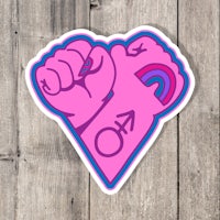a pink heart with a rainbow on it