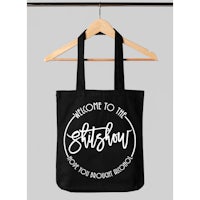a black tote bag that says welcome to the shitshow
