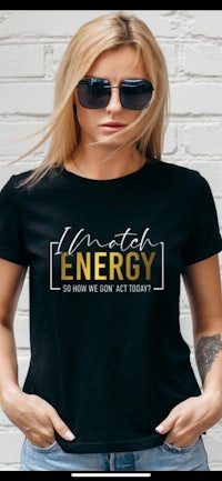 a women's black t - shirt that says i'm a little energy